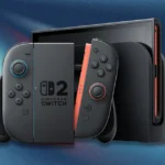 Consola Nintendo Switch 2 con su dock y mandos Joy-Con acoplados sobre un fondo degradado azul y rojo.